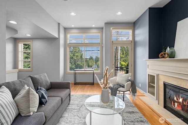 7747 Sand Point Way NE Unit A, Seattle, WA 98115 - living room with a tile fireplace, wood finished floors, and recessed lighting