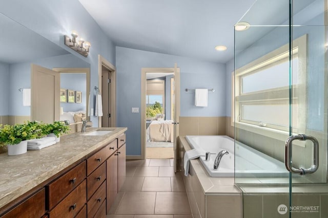 7747 Sand Point Way NE Unit A, Seattle, WA 98115 - full bath featuring ensuite bath, vanity, a garden tub, and tile patterned floors