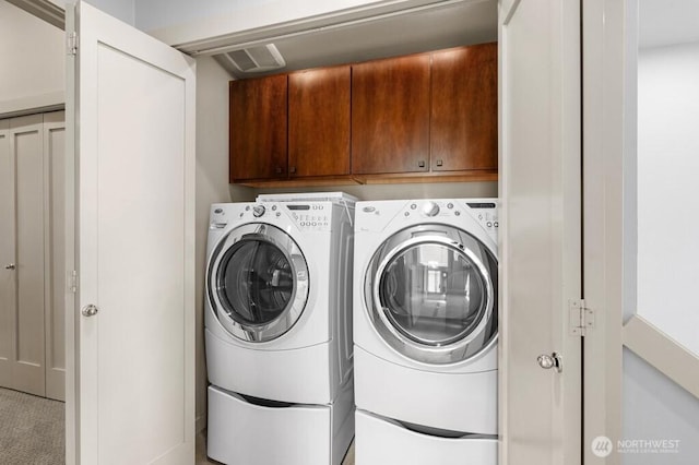 7747 Sand Point Way NE Unit A, Seattle, WA 98115 - laundry room with cabinet space and washer and dryer
