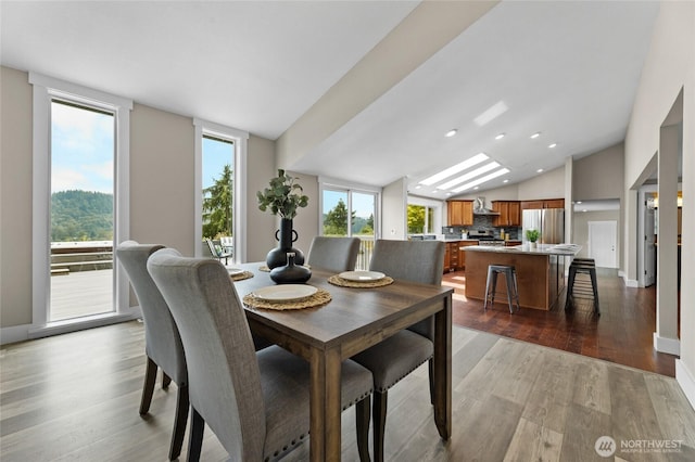 12712 232nd Ave E, Buckley, WA 98321 - dining area featuring vaulted ceiling, wood finished floors, and recessed lighting