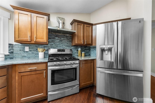12712 232nd Ave E, Buckley, WA 98321 - kitchen featuring stainless steel appliances, tasteful backsplash, light stone countertops, and brown cabinetry