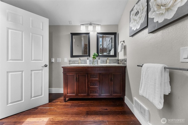 12712 232nd Ave E, Buckley, WA 98321 - bathroom featuring double vanity and wood finished floors