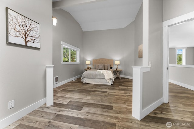 12712 232nd Ave E, Buckley, WA 98321 - bedroom featuring vaulted ceiling, multiple windows, and wood finished floors
