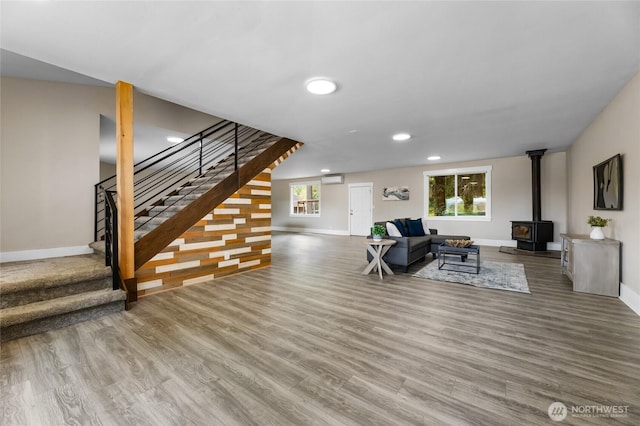 12712 232nd Ave E, Buckley, WA 98321 - living room with wood finished floors, stairs, recessed lighting, and a wood stove