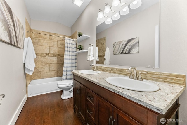 12712 232nd Ave E, Buckley, WA 98321 - full bathroom featuring double vanity, shower / bathtub combination with curtain, wood finished floors, and backsplash