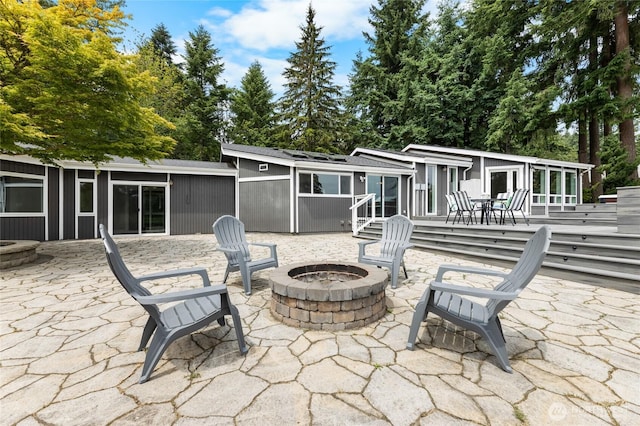 12712 232nd Ave E, Buckley, WA 98321 - view of patio / terrace featuring an outdoor fire pit