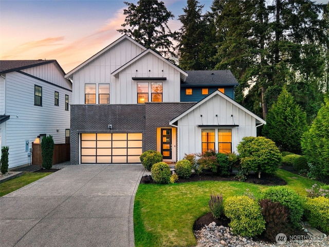 8784 NE Winslow Grove Ct, Bainbridge Island, WA 98110 - view of front facade featuring board and batten siding, an attached garage, concrete driveway, and a lawn