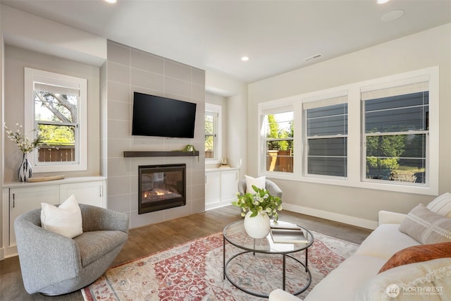 8784 NE Winslow Grove Ct, Bainbridge Island, WA 98110 - living area with wood finished floors, plenty of natural light, recessed lighting, and a tile fireplace