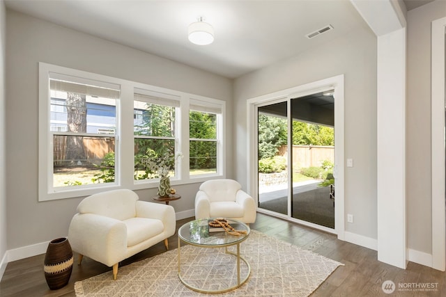 8784 NE Winslow Grove Ct, Bainbridge Island, WA 98110 - sitting room with wood finished floors and arched walkways