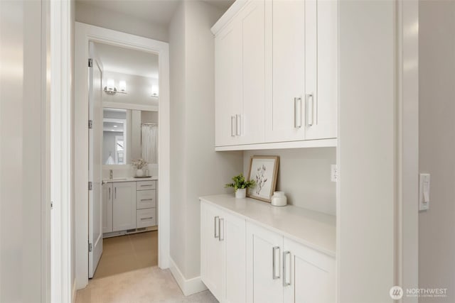 8784 NE Winslow Grove Ct, Bainbridge Island, WA 98110 - corridor with light tile patterned floors and light colored carpet