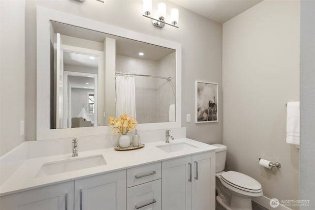 8784 NE Winslow Grove Ct, Bainbridge Island, WA 98110 - bathroom featuring double vanity, a shower with curtain, and recessed lighting