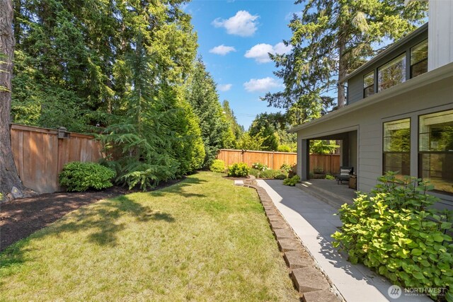8784 NE Winslow Grove Ct, Bainbridge Island, WA 98110 - fenced backyard featuring a patio area