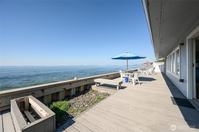 1523 N Whitecap Ln, Oak Harbor, WA 98277 - wooden terrace with a water view and outdoor dining space