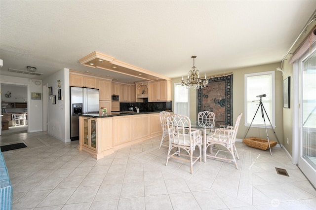 1523 N Whitecap Ln, Oak Harbor, WA 98277 - dining room with a chandelier and light tile patterned flooring