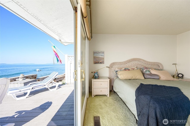 1523 N Whitecap Ln, Oak Harbor, WA 98277 - bedroom featuring a water view and carpet flooring