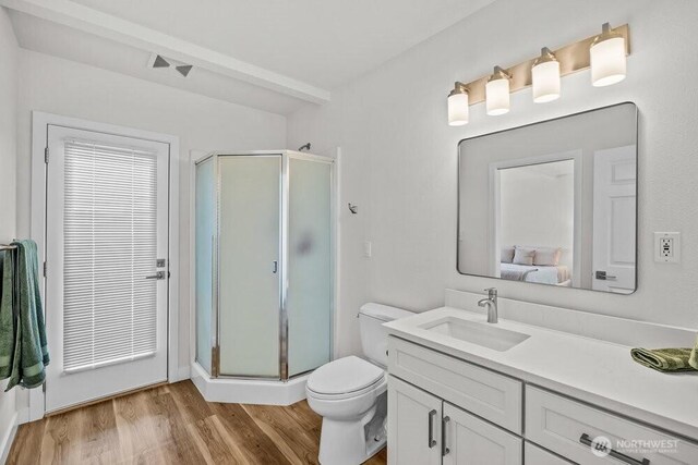 491 Pebble Beach Dr, Cle Elum, WA 98922 - ensuite bathroom featuring a shower stall, vanity, and wood finished floors