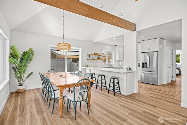 491 Pebble Beach Dr, Cle Elum, WA 98922 - dining space with light wood-style flooring and high vaulted ceiling