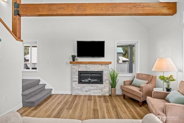 491 Pebble Beach Dr, Cle Elum, WA 98922 - living area with stairway, wood finished floors, plenty of natural light, and a fireplace
