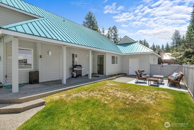 491 Pebble Beach Dr, Cle Elum, WA 98922 - back of house featuring a standing seam roof, a patio, a metal roof, and outdoor lounge area