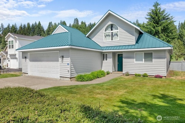 491 Pebble Beach Dr, Cle Elum, WA 98922 - view of front facade featuring an attached garage, a standing seam roof, concrete driveway, and a front yard