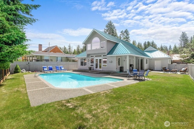 491 Pebble Beach Dr, Cle Elum, WA 98922 - back of property with a metal roof, a fenced backyard, a patio, and a standing seam roof