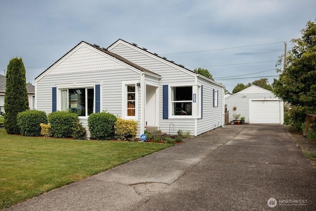 526 20th Ave, Longview, WA 98632 - view of front facade with an outdoor structure, a front lawn, driveway, and a garage