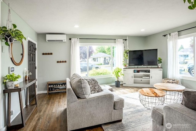 526 20th Ave, Longview, WA 98632 - living area with an AC wall unit, wood finished floors, and recessed lighting