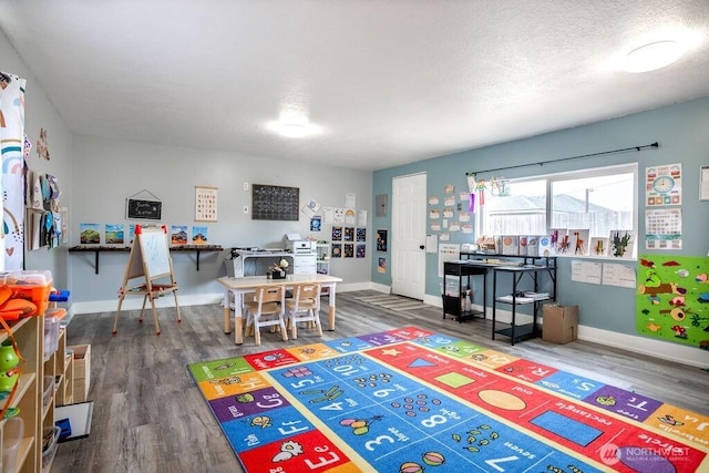 526 20th Ave, Longview, WA 98632 - playroom featuring wood finished floors and a textured ceiling