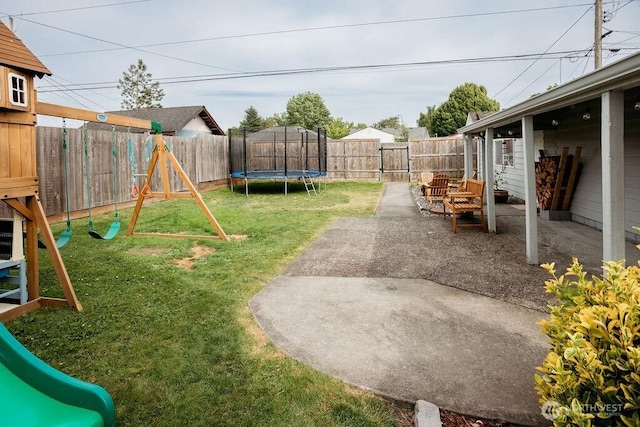 526 20th Ave, Longview, WA 98632 - fenced backyard with a playground, a trampoline, and a patio