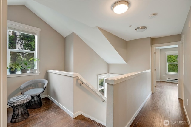 3116 164th St SW Unit 806, Lynnwood, WA 98087 - hall featuring an upstairs landing, a baseboard radiator, wood finished floors, and vaulted ceiling
