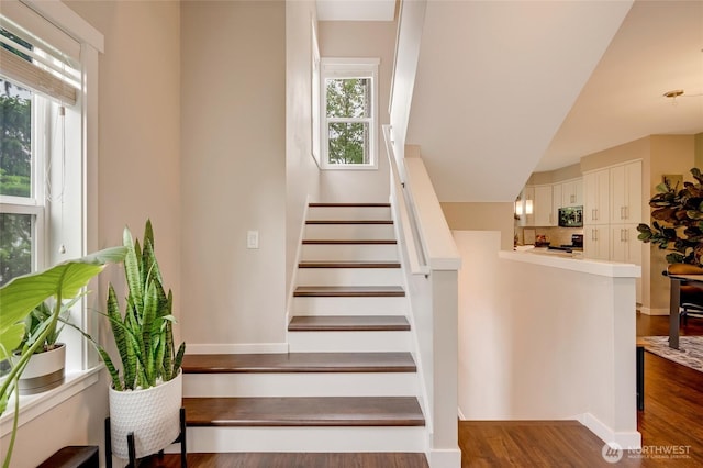 3116 164th St SW Unit 806, Lynnwood, WA 98087 - staircase featuring healthy amount of natural light and wood finished floors