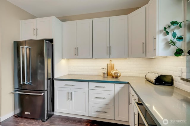 3116 164th St SW Unit 806, Lynnwood, WA 98087 - kitchen featuring high quality fridge, dark wood-style flooring, white cabinetry, tasteful backsplash, and light countertops