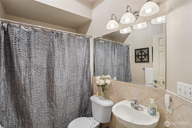15000 Juanita Dr NE Unit 309, Kenmore, WA 98028 - bathroom with backsplash and tile walls