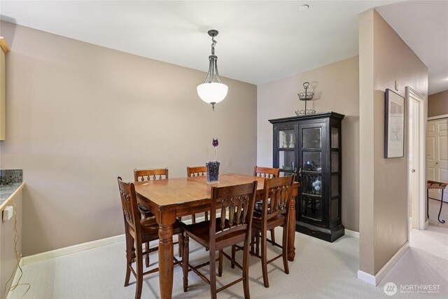 15000 Juanita Dr NE Unit 309, Kenmore, WA 98028 - dining space with baseboards and light colored carpet