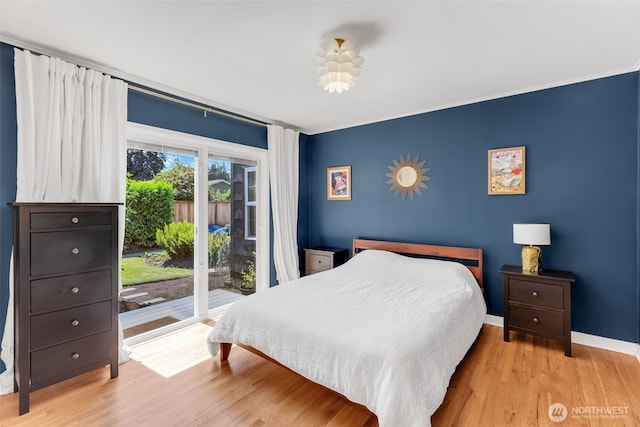804 Electron Way, Fircrest, WA 98466 - bedroom with access to exterior, wood finished floors, and ornamental molding