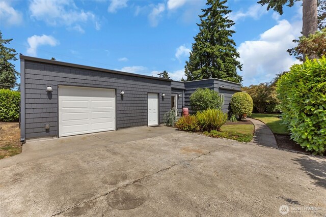 804 Electron Way, Fircrest, WA 98466 - view of front of house with concrete driveway and a garage