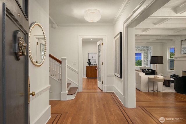740 22nd Ave E, Seattle, WA 98112 - hallway with wood finished floors, stairs, coffered ceiling, ornamental molding, and beam ceiling