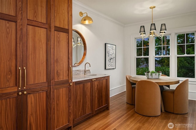 740 22nd Ave E, Seattle, WA 98112 - dining area with wood finished floors, crown molding, and a chandelier