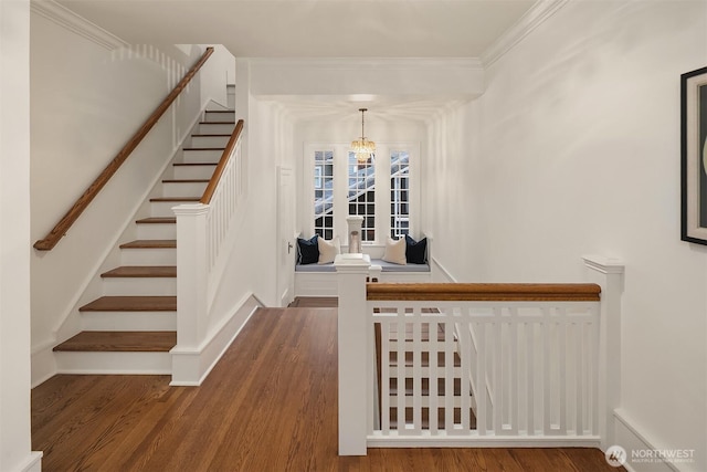 740 22nd Ave E, Seattle, WA 98112 - staircase featuring a chandelier, wood finished floors, and ornamental molding