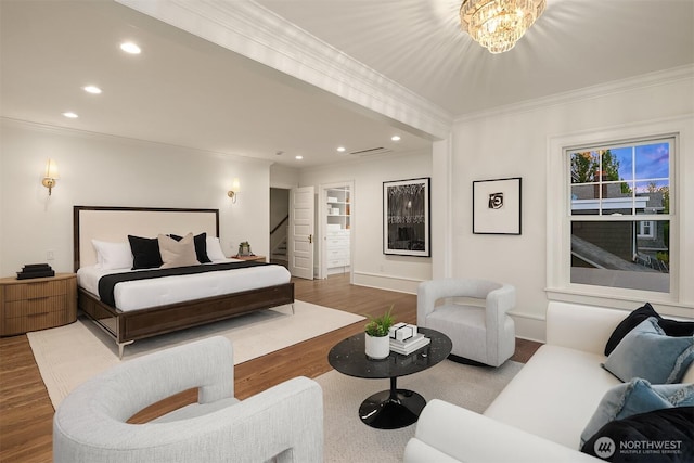 740 22nd Ave E, Seattle, WA 98112 - bedroom with wood finished floors, recessed lighting, crown molding, and a chandelier