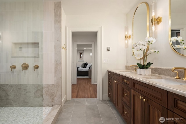 740 22nd Ave E, Seattle, WA 98112 - bathroom featuring connected bathroom, double vanity, tile patterned flooring, and walk in shower