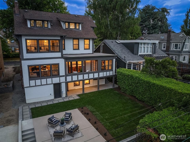 740 22nd Ave E, Seattle, WA 98112 - rear view of house featuring stucco siding, a chimney, a patio area, a shingled roof, and a yard