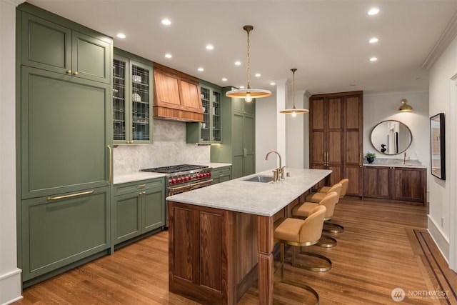 740 22nd Ave E, Seattle, WA 98112 - kitchen featuring green cabinets, custom range hood, tasteful backsplash, light countertops, and recessed lighting