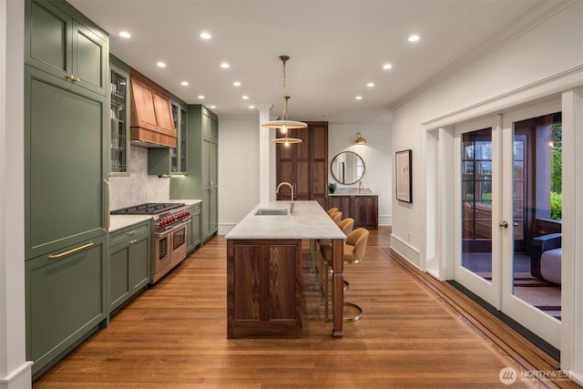 740 22nd Ave E, Seattle, WA 98112 - kitchen with green cabinets, high end appliances, crown molding, french doors, and recessed lighting