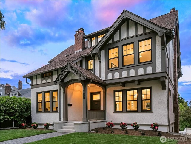 740 22nd Ave E, Seattle, WA 98112 - tudor home featuring stucco siding, a chimney, and a porch