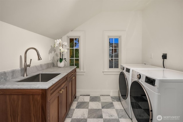 740 22nd Ave E, Seattle, WA 98112 - washroom featuring cabinet space and washer and dryer
