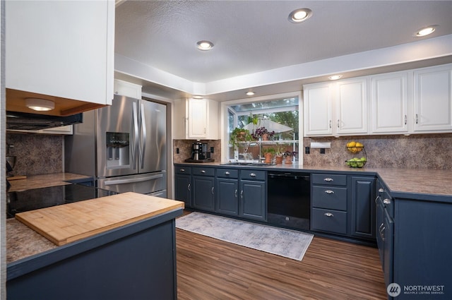 16420 92nd Avenue Ct E, Puyallup, WA 98375 - kitchen featuring dishwasher, stainless steel fridge, white cabinetry, blue cabinetry, and tasteful backsplash