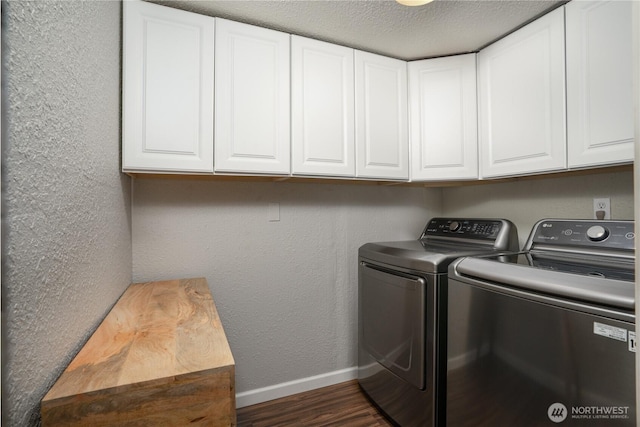 16420 92nd Avenue Ct E, Puyallup, WA 98375 - laundry area featuring washing machine and dryer, dark wood finished floors, cabinet space, a textured wall, and a textured ceiling