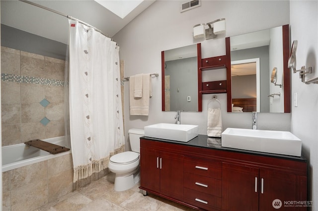 16420 92nd Avenue Ct E, Puyallup, WA 98375 - bathroom featuring double vanity, tiled shower / bath combo, and vaulted ceiling