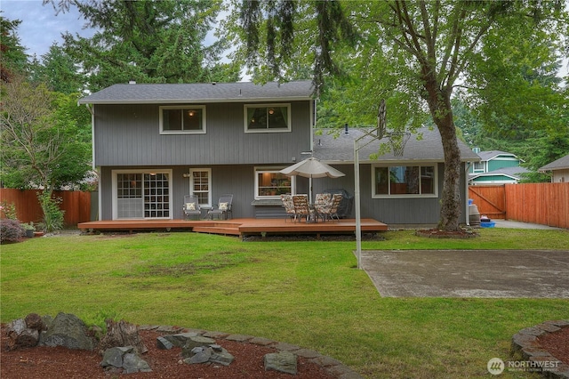 16420 92nd Avenue Ct E, Puyallup, WA 98375 - rear view of property featuring a fenced backyard, a deck, and roof with shingles